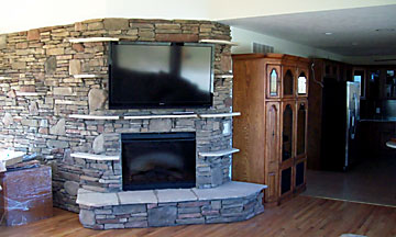custom stone fireplace with stone mantel